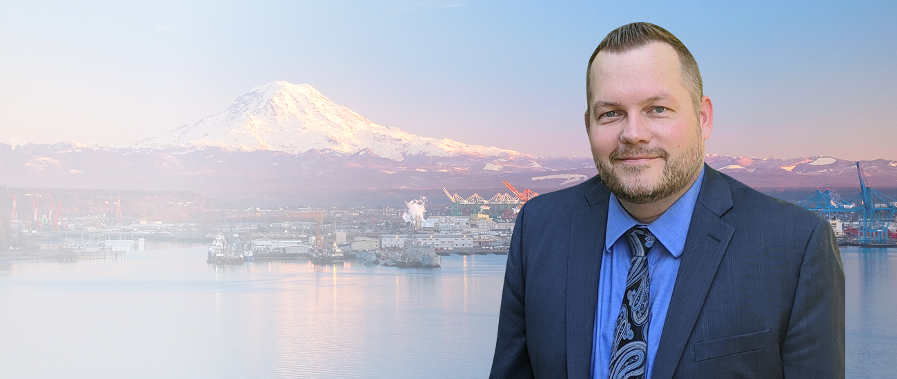 Profile picture of Matthew J. Yetter, set against a background featuring a pier and snow-capped mountains.