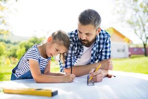 Father With Daughter Outside Planning